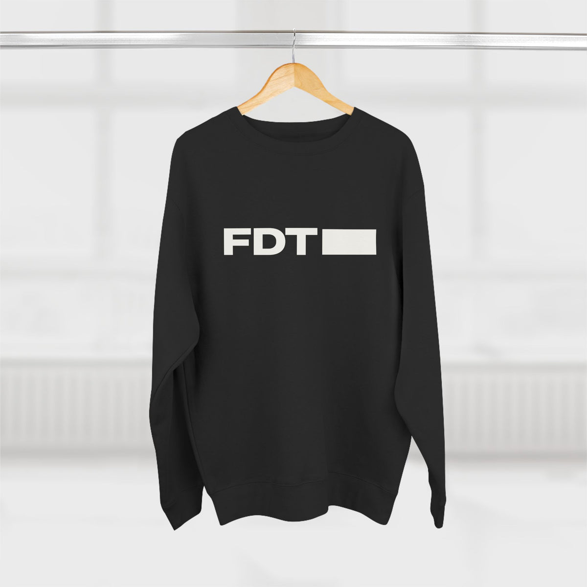 FDT Wordmark Crewneck in Black, hanging view (supplier mockup)