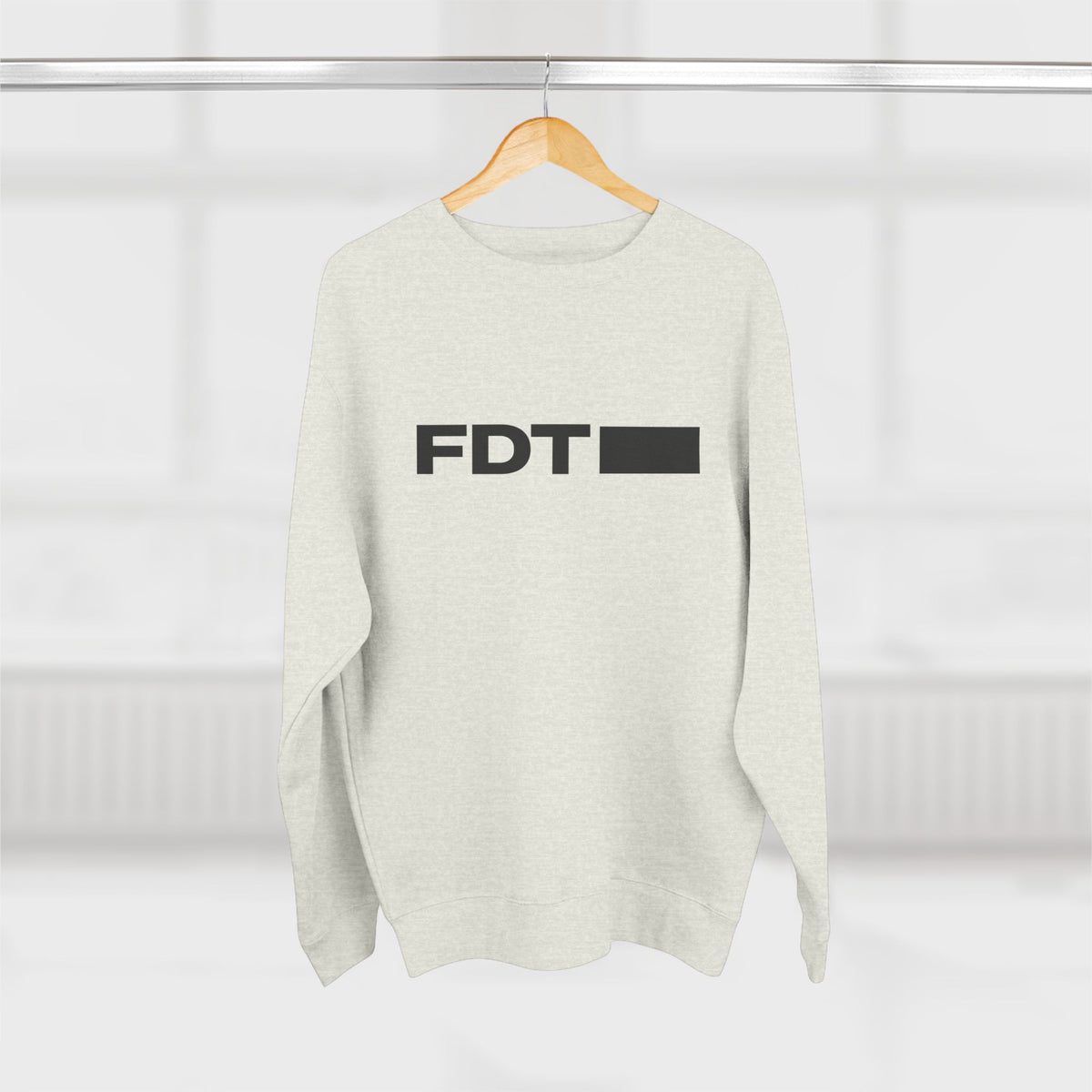 FDT Wordmark Crewneck in Oatmeal Heather, hanging view (supplier mockup)